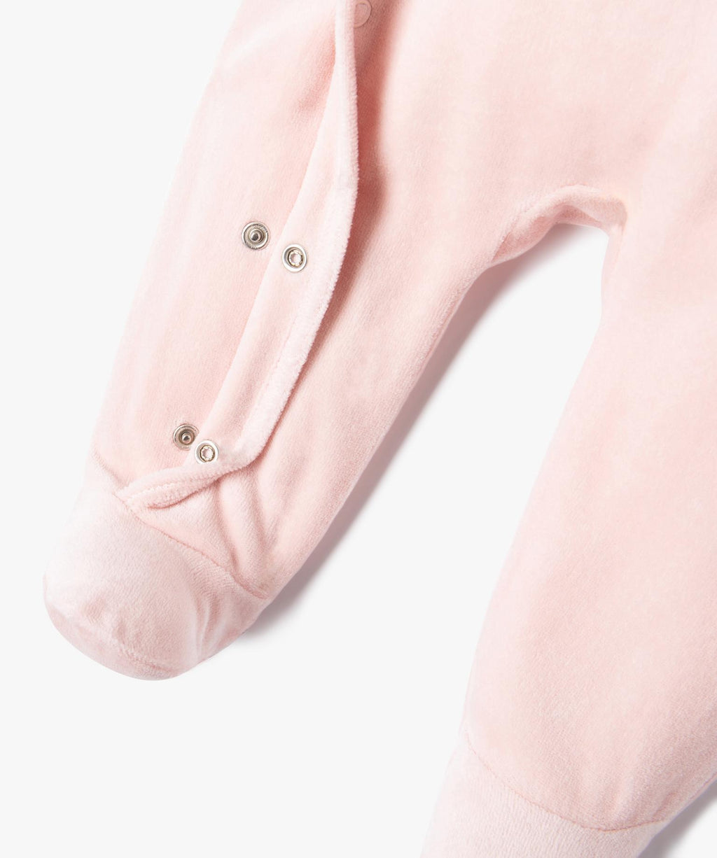 Pink velour pyjamas with glittery lettering for baby girl