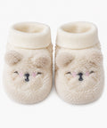 GÉMO cream teddy bear plush baby booties with embroidered sleepy faces, 0–3 months