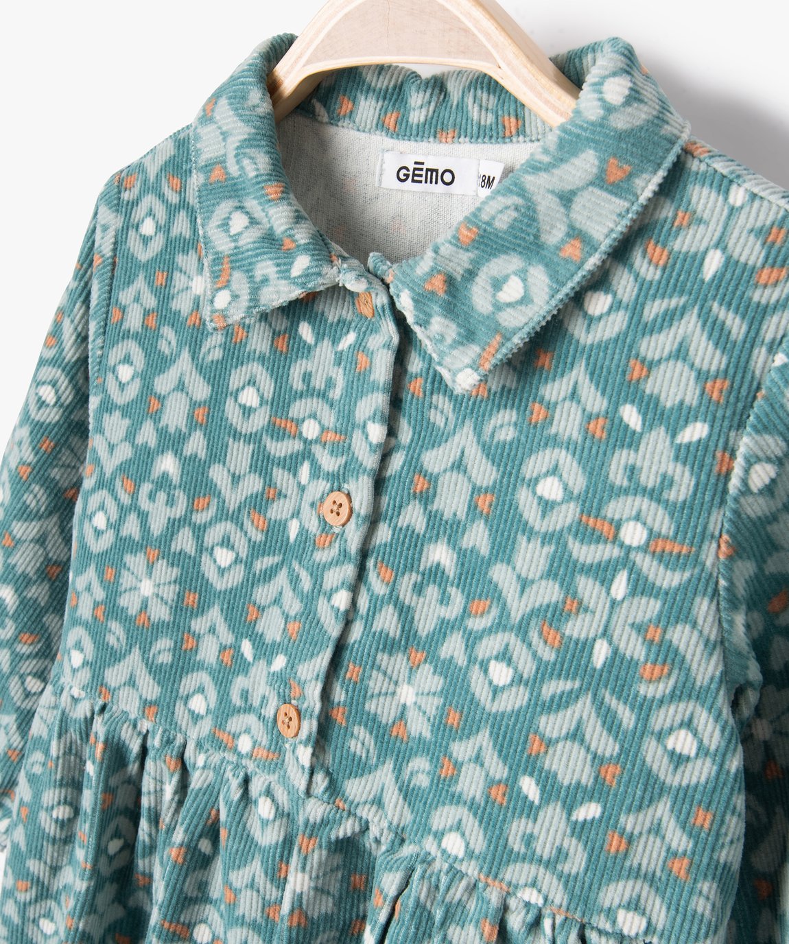 Close-up of the GÉMO teal floral long-sleeve baby dress collar and buttons