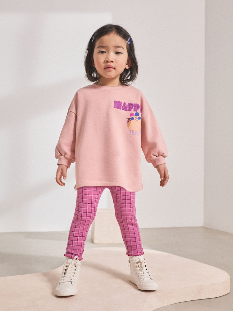 Front of Next girls pink bunny sweatshirt and checked leggings set