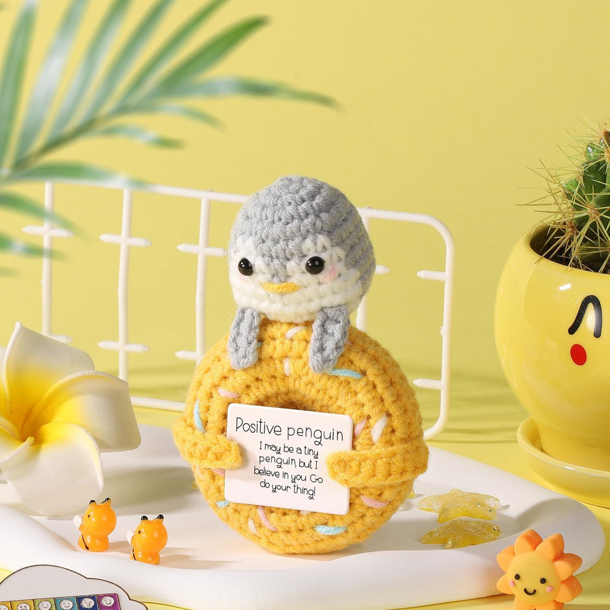 Crochet penguin donut character on display