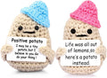 Positive crochet potato toys with blue and pink hats