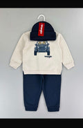 Dog in Car print: cream Wrangler sweatshirt and navy trousers; beanie photographed